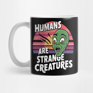 Humans are strange creatures Mug